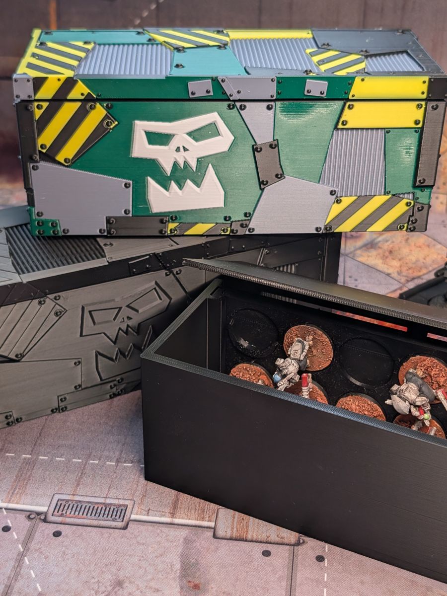 The plain case with its tray pulled out, showing miniatures in the cutouts
