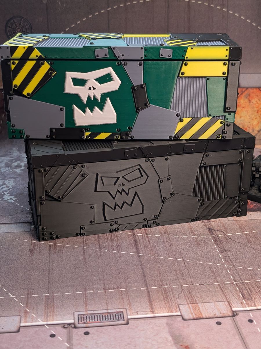 The themed case stacked on top of the plain black version